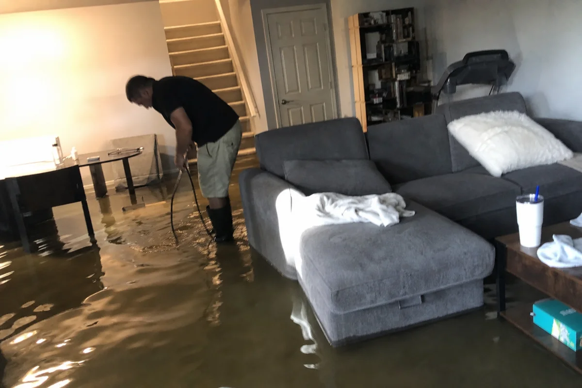 Finished Highlands Ranch basement with standing water