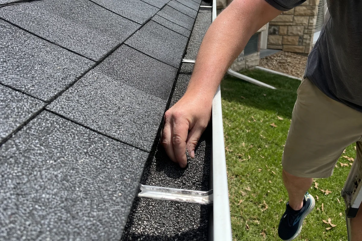 Granule loss from hail-damaged shingles in gutter