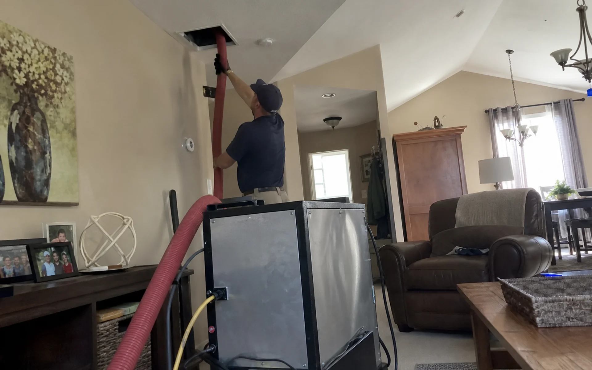 Negative-pressure duct cleaning machine connected to home HVAC