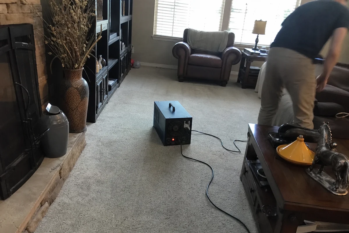Ozone generator running in a smoke-damaged living room