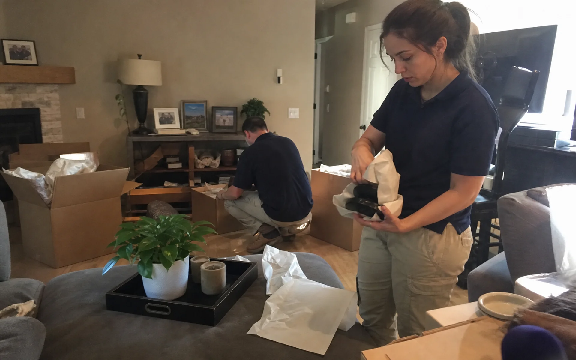 Restoration crew packing belongings for pack-out