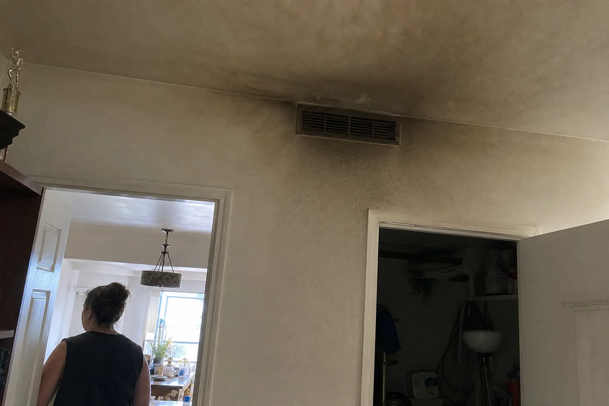 Smoke residue around an HVAC vent far from fire origin