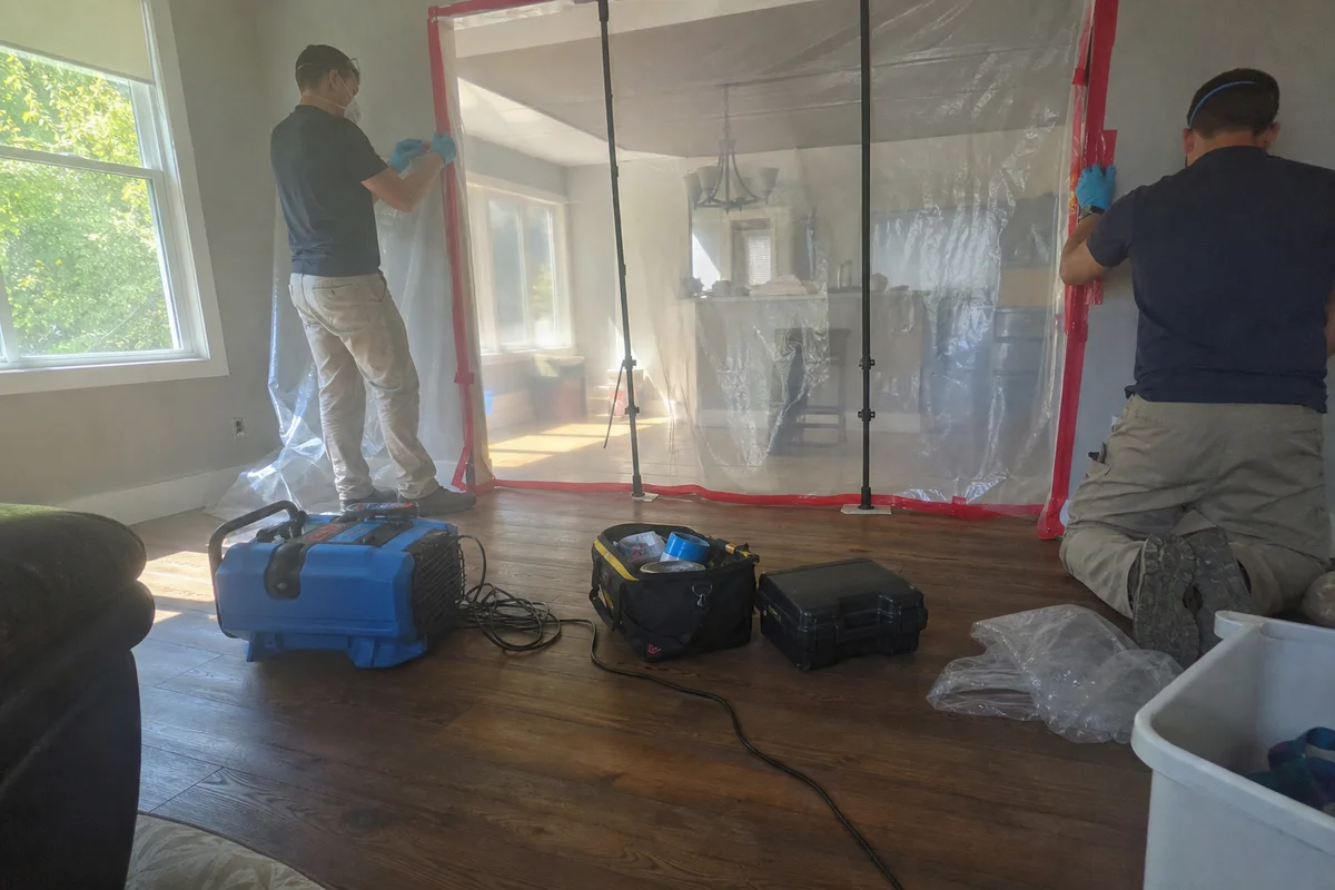 Technicians calmly setting up containment